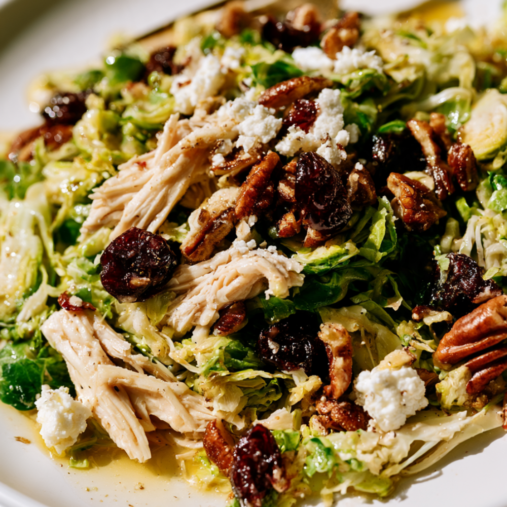 Brussels Sprout Salad with Cranberries, Pecans, & Maple-Dijon Vinaigrette-plated
