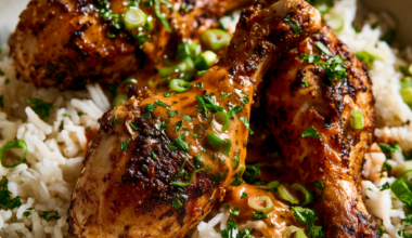 Cajun Butter Crockpot Chicken Drumsticks over rice