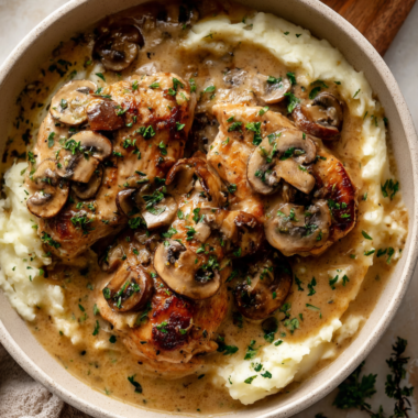 Cream of Mushroom Chicken Crockpot Recipe - over mashed potatoes